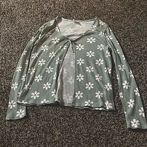 This is a soft green & white flowered cardigan